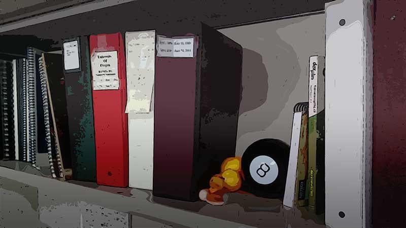 Decorative backround - binders on a shelf with an 8 ball